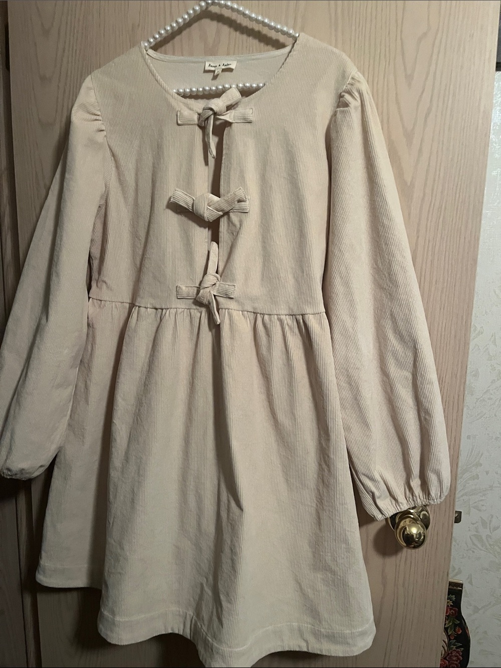 Soft Cream Woman’s Dress with Bow Details